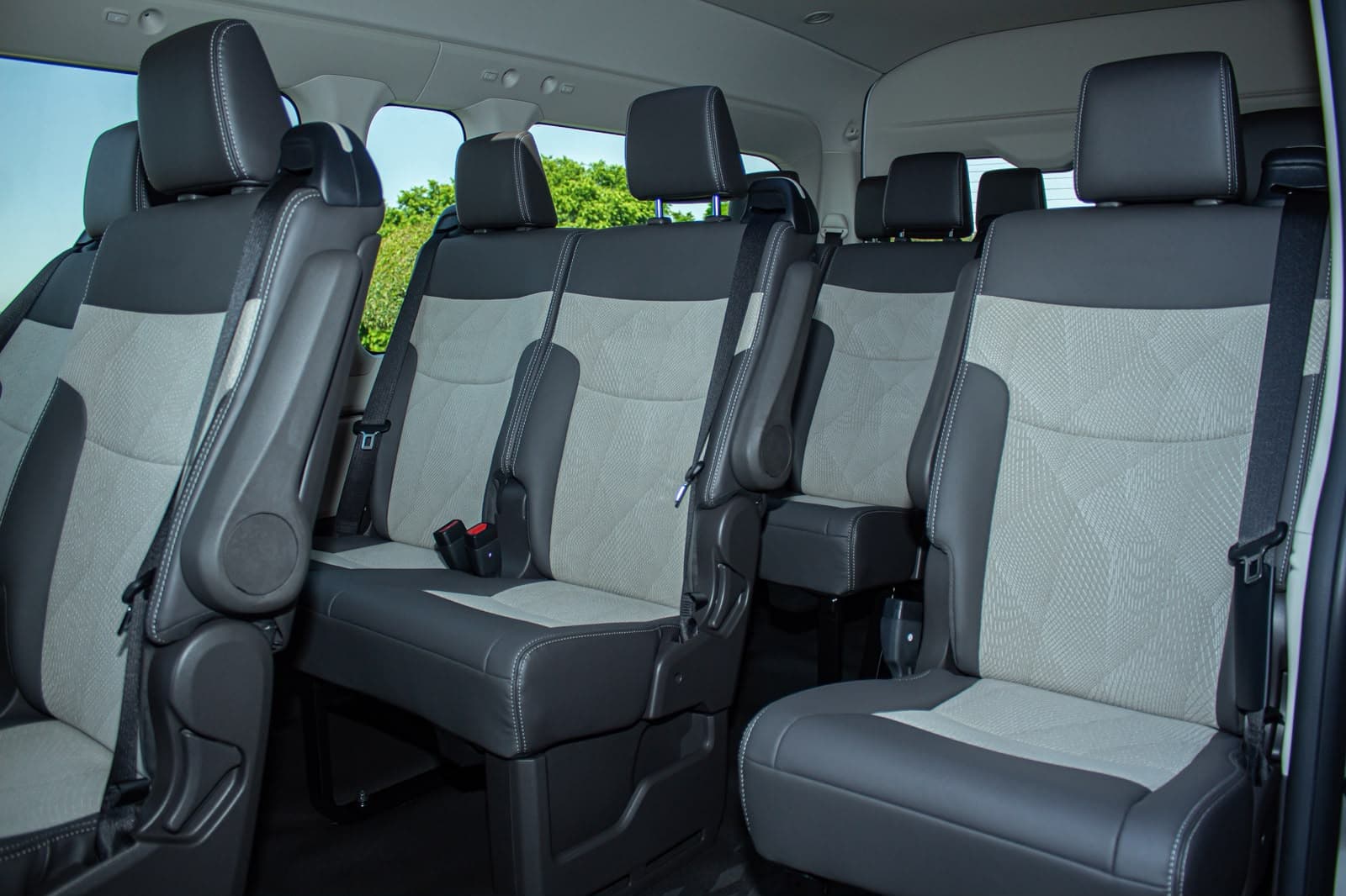 Comfortable spacious passenger seating inside Mutsinda Shuttles Toyota Quantum airport transfer vehicle